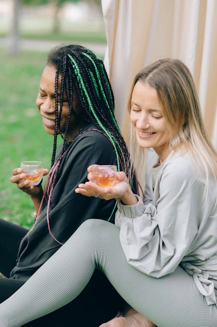 Diverse group of smiling people of different ages sitting on yoga mats